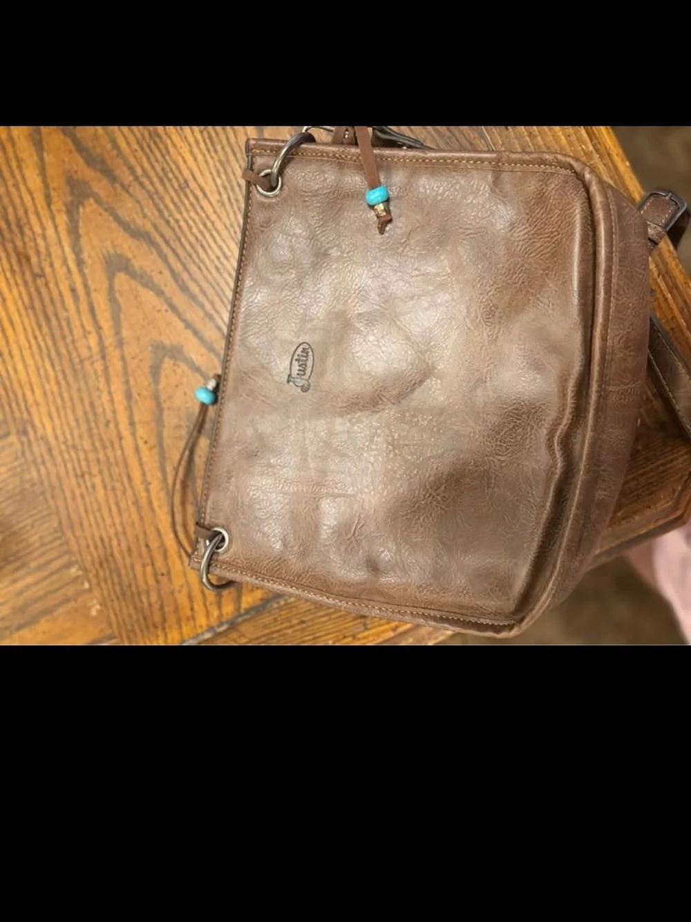 Brown Leather Crossbody Bag with Cowhide Accent and Patterned Strap